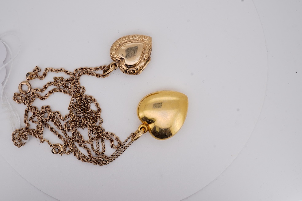 A modern embossed 9ct gold heart shaped locket, 21mm, on a similar 9ct gold rope twist chain, 46cm, together with one other yellow metal heart shaped locket, on a yellow metal chain, gross weight 14.5 grams. Condition -